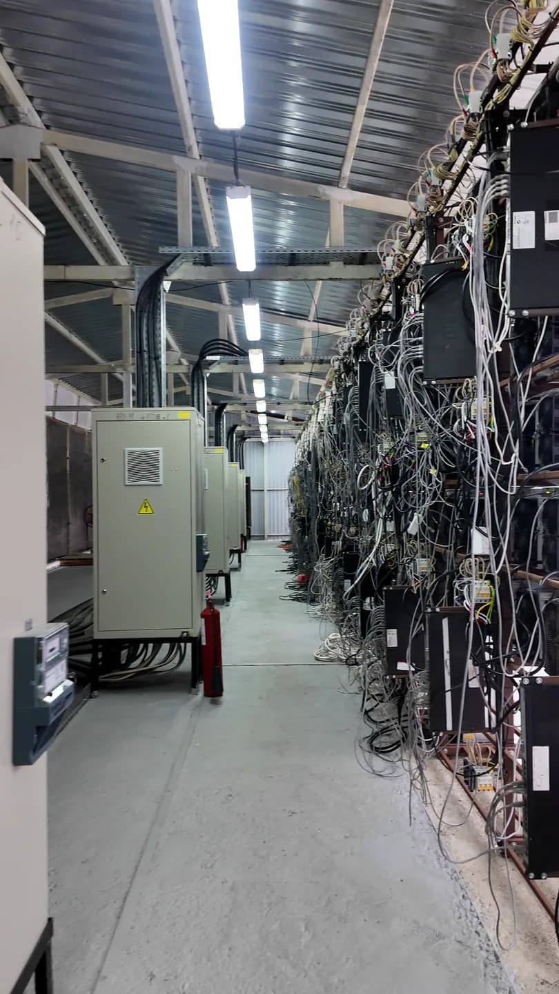 ASIC miners installed in a managed hosting rack aisle