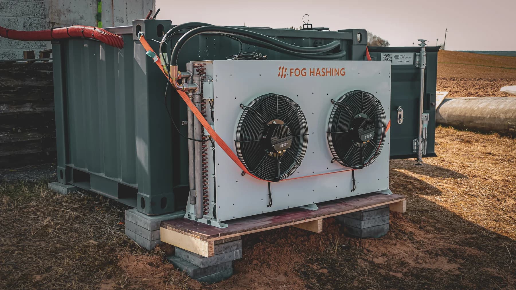 Fog Hashing cooling equipment installed beside a container at a Lithuanian wind-energy site