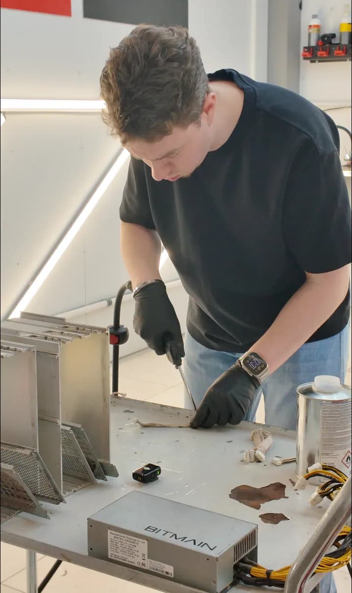 ASIC miner being cleaned during service