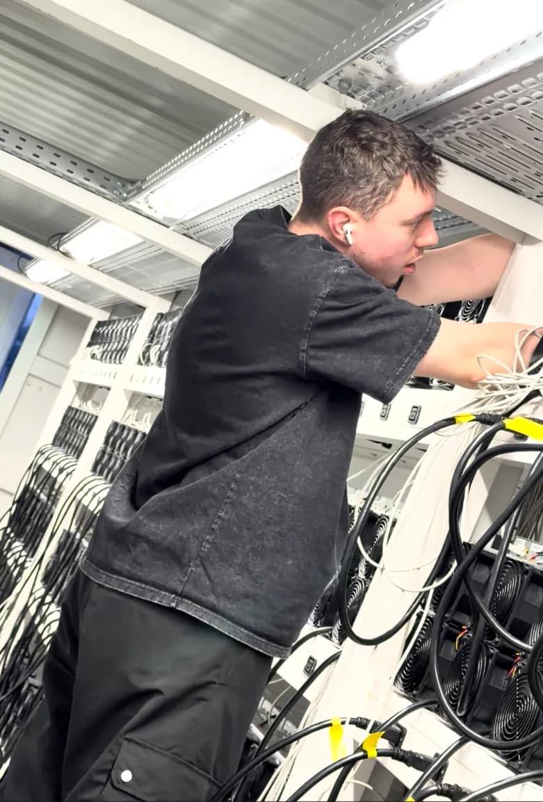 Technician commissioning a mining container