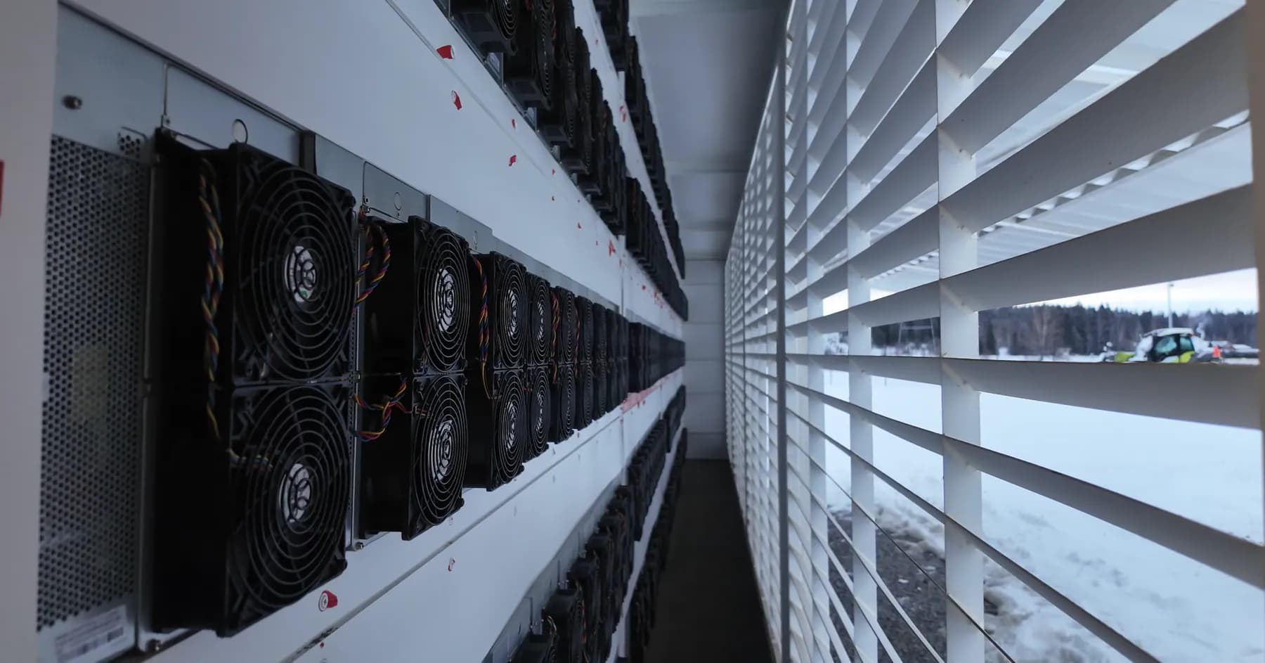 ASIC miners and ventilation louvers inside a container