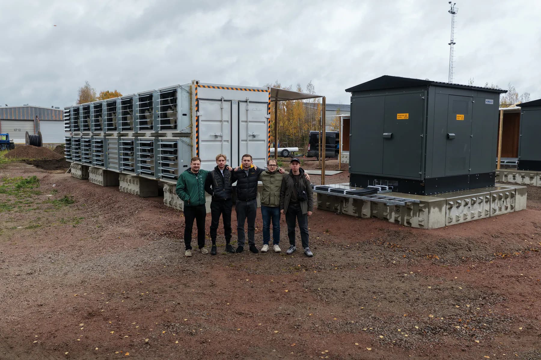 Project team beside container infrastructure