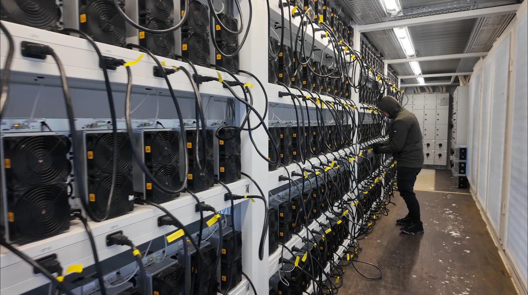 Populated ASIC racks inside a modular mining container