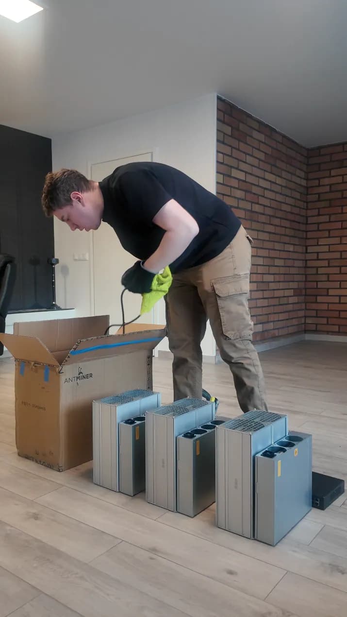 Technician installing a compact mining heating system