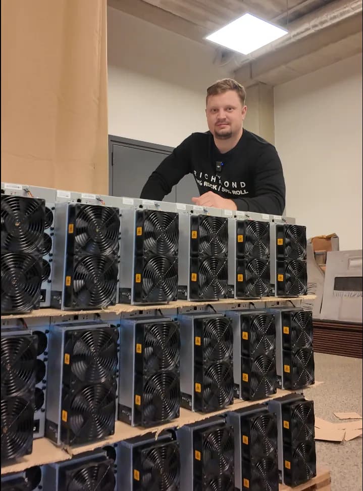 Oleg Angelsky with ASIC miners in the office