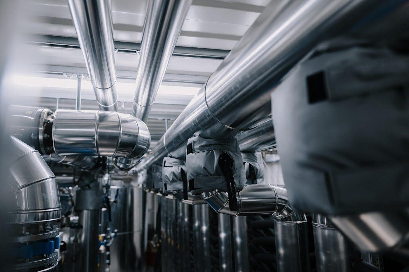 Insulated pipe infrastructure for an industrial hydro mining and heat-transfer system