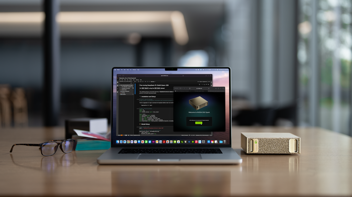 NVIDIA DGX Spark compact AI computer beside a laptop on a desk